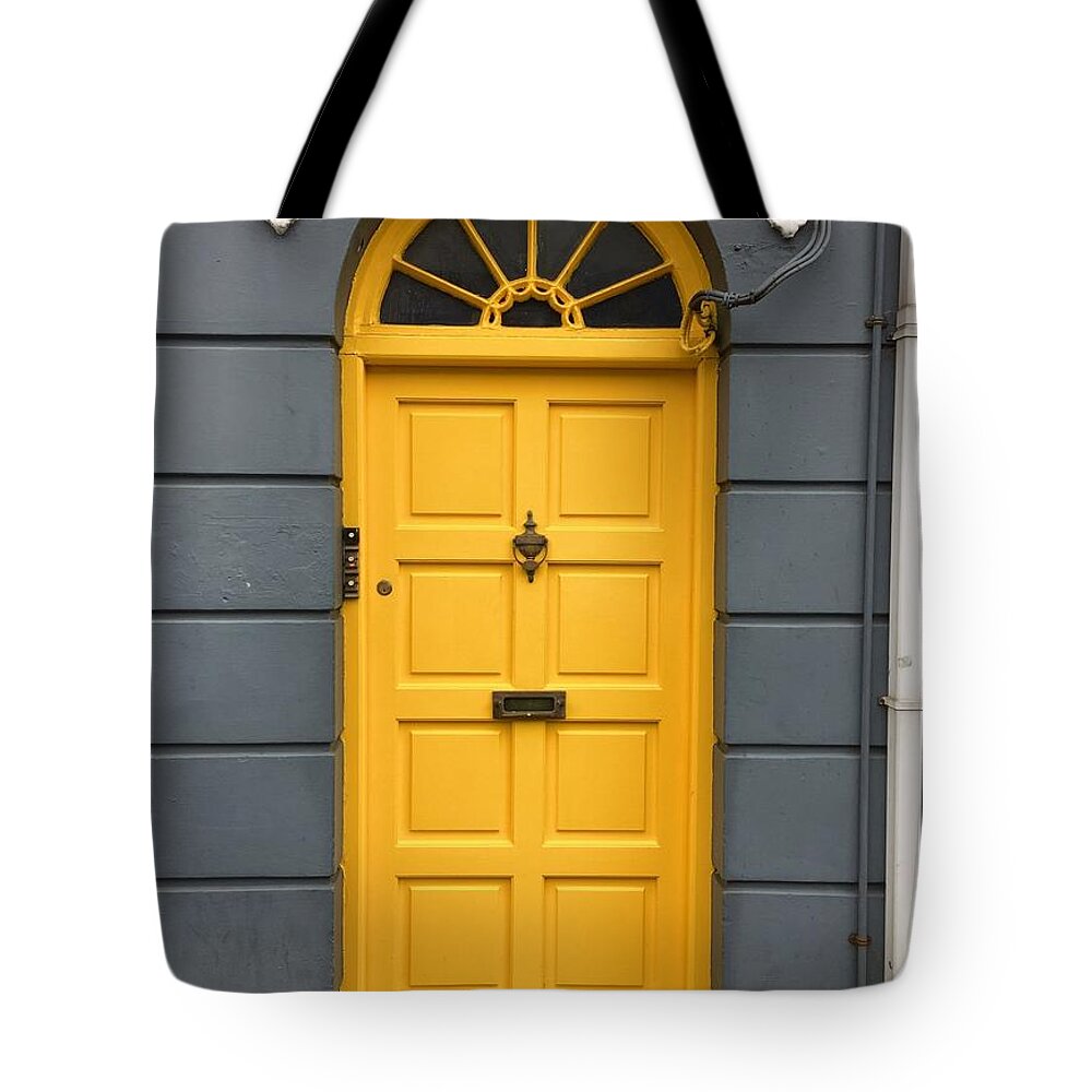 Yellow Tote Bag featuring the photograph A yellow door in Ireland by Suzanne Lorenz