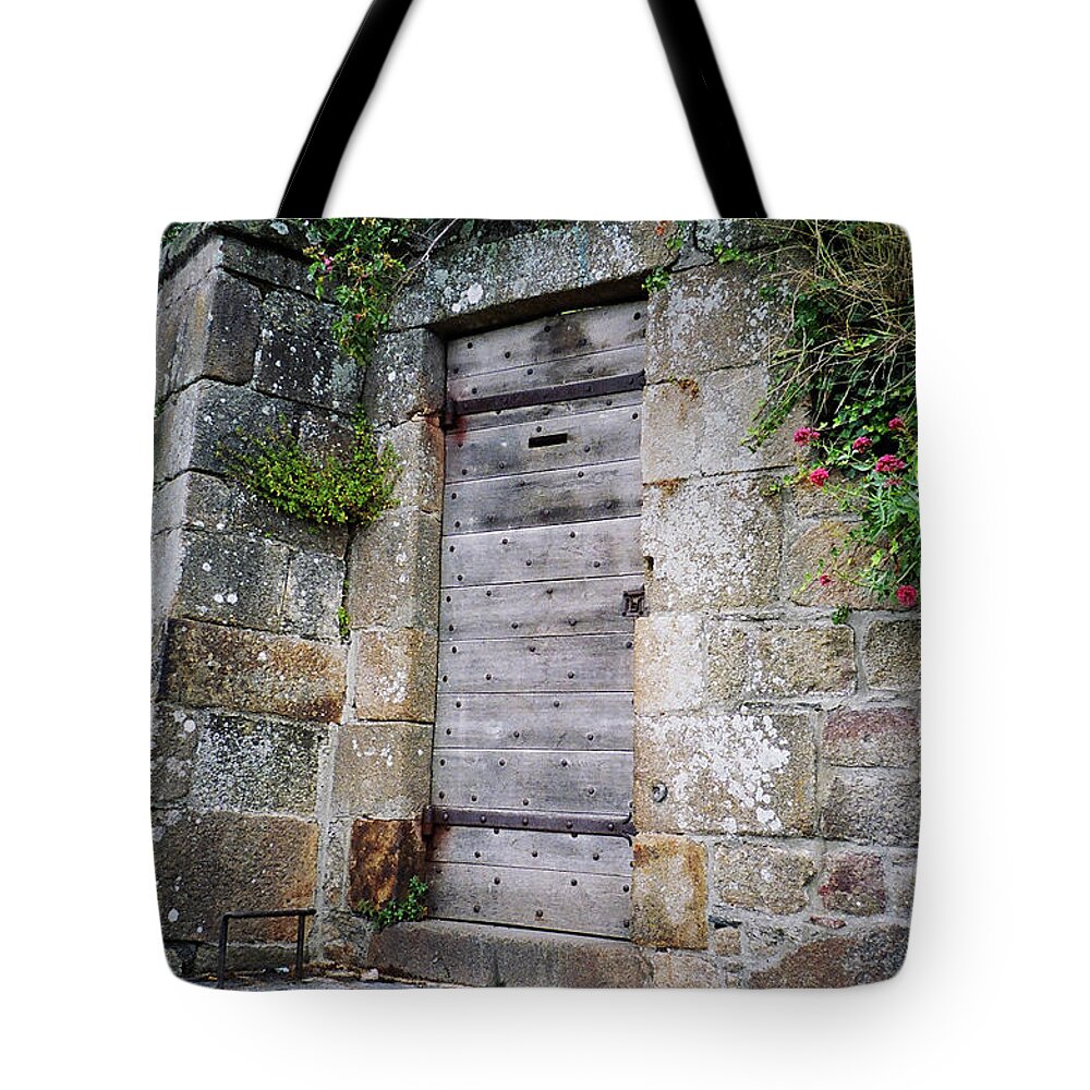 Portrait Tote Bag featuring the photograph Abbey Side Door by Donna L Munro