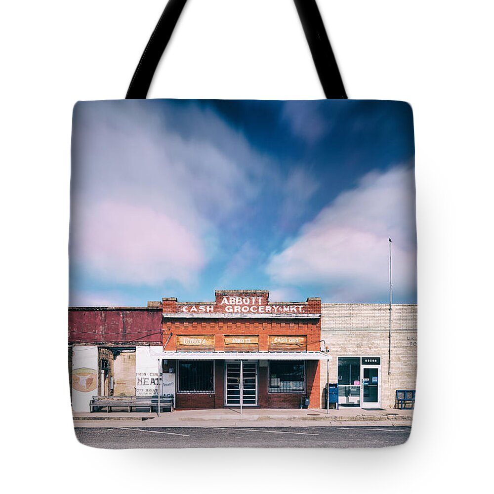 Joseph Tote Bag featuring the photograph Abbott A Quitter Never Wins And A Winner Never Quits - Willie Nelson's Birthplace Texas by Silvio Ligutti
