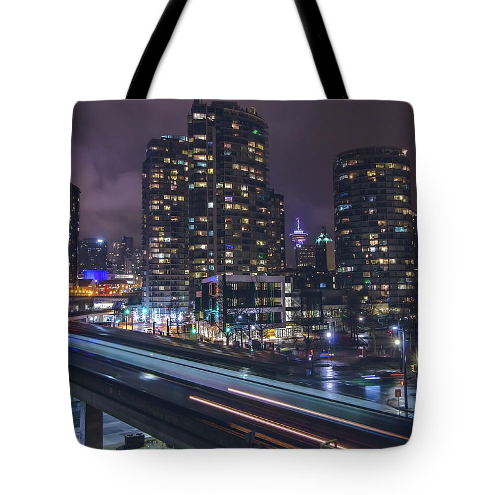 Vancouver Tote Bag featuring the photograph Above the Skytrain by Jay Smith