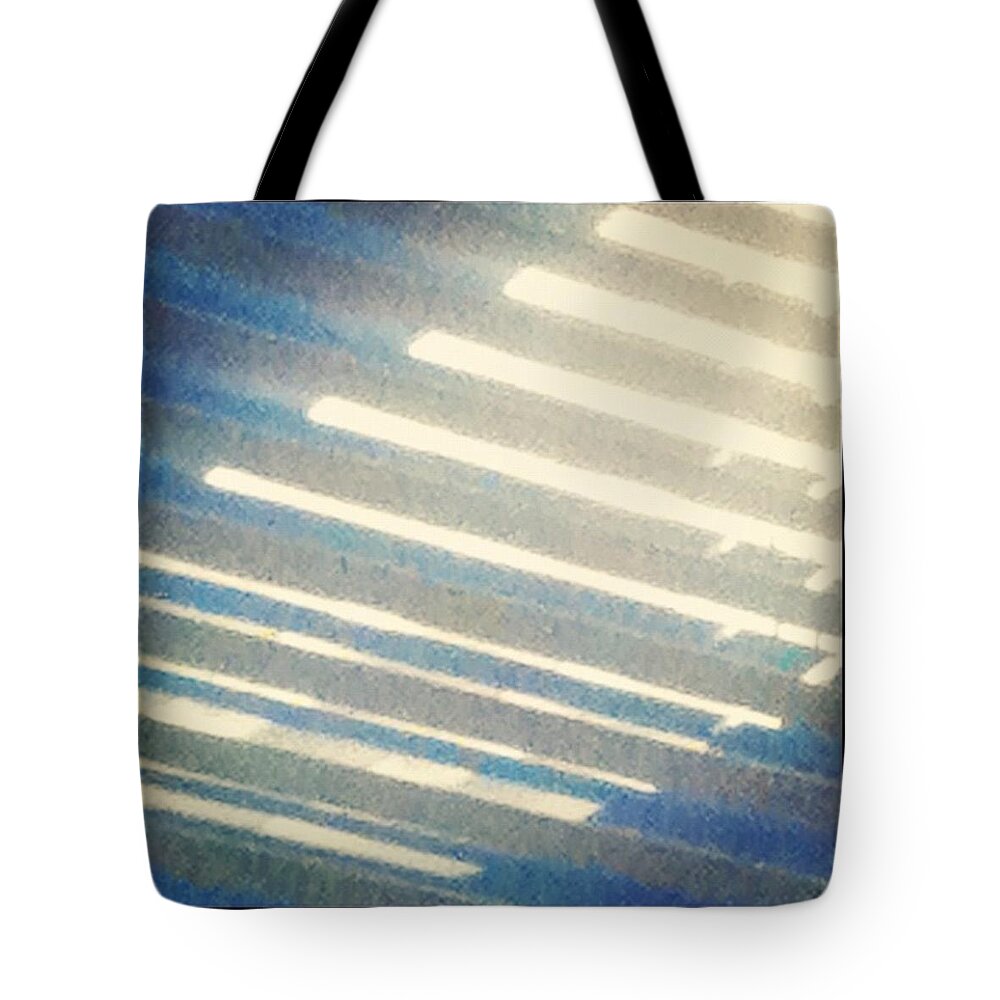 Light Tote Bag featuring the photograph Blue light by Heather Classen