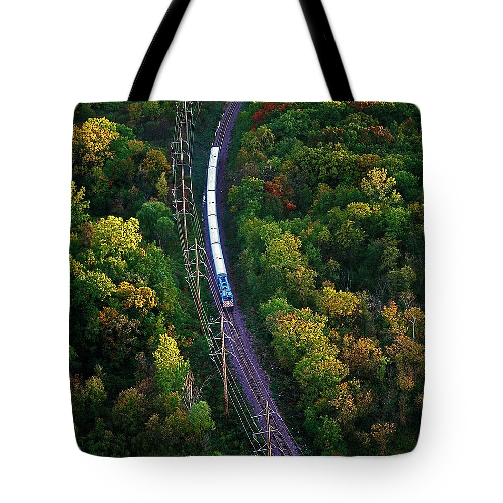 Aerial Tote Bag featuring the photograph Aerial of commuter train by Tom Jelen