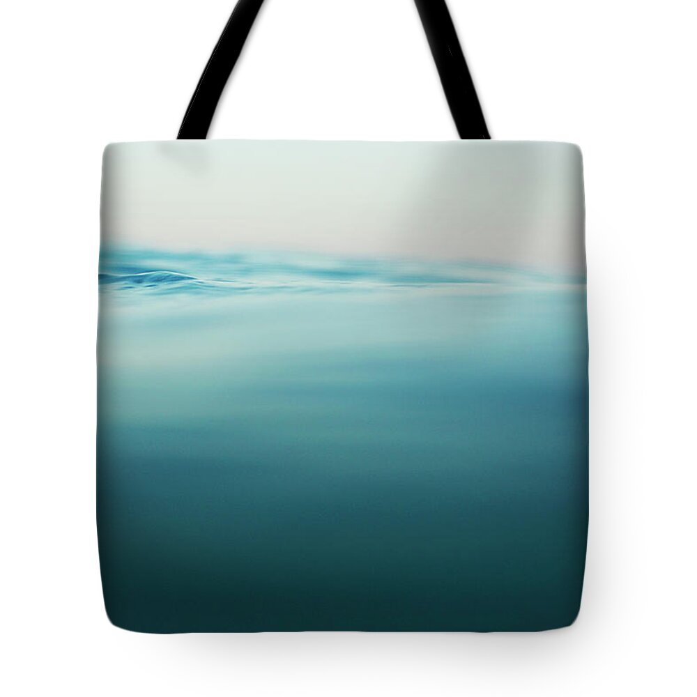 Surfing Tote Bag featuring the photograph Agua by Nik West