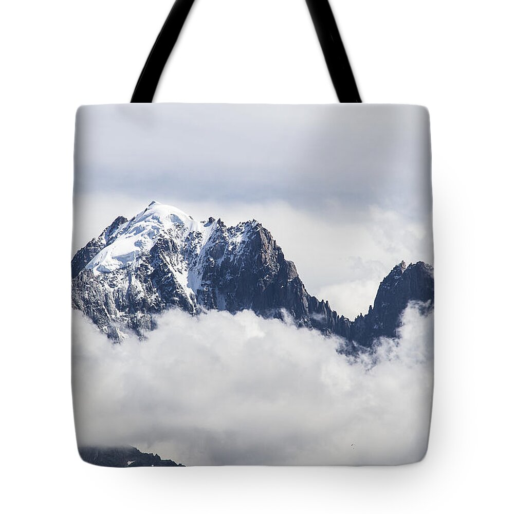 Mountain Landscape Tote Bag featuring the photograph Aiguille Verte and Aiguille du Dru in the clouds - Chamonix - French Alps by Paul MAURICE