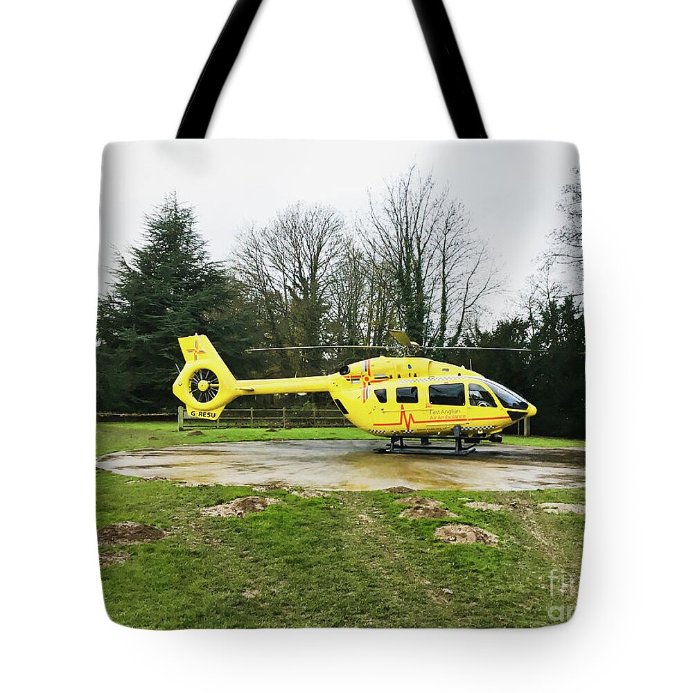 N.h.s. Tote Bag featuring the photograph Air ambulance helicopter by Tom Gowanlock