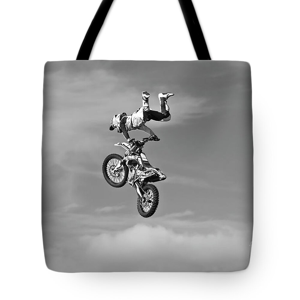 Motorsport Tote Bag featuring the photograph Airborne motorcycle by Yurix Sardinelly