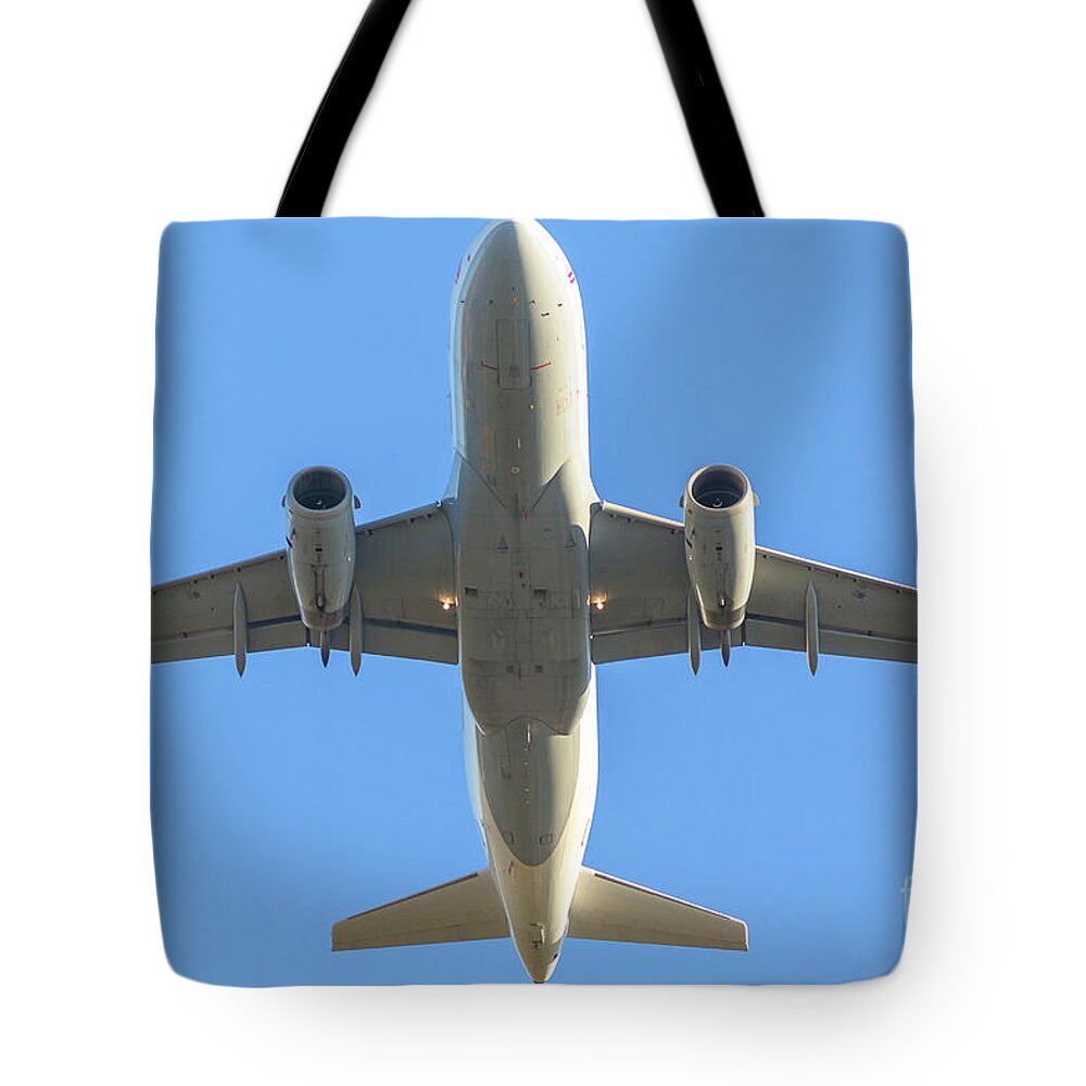 Aircraft Tote Bag featuring the photograph Airplane Isolated In The Sky by Benny Marty