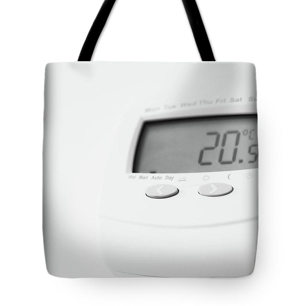 Adjustment Tote Bag featuring the photograph An electric thermostat by Tom Gowanlock