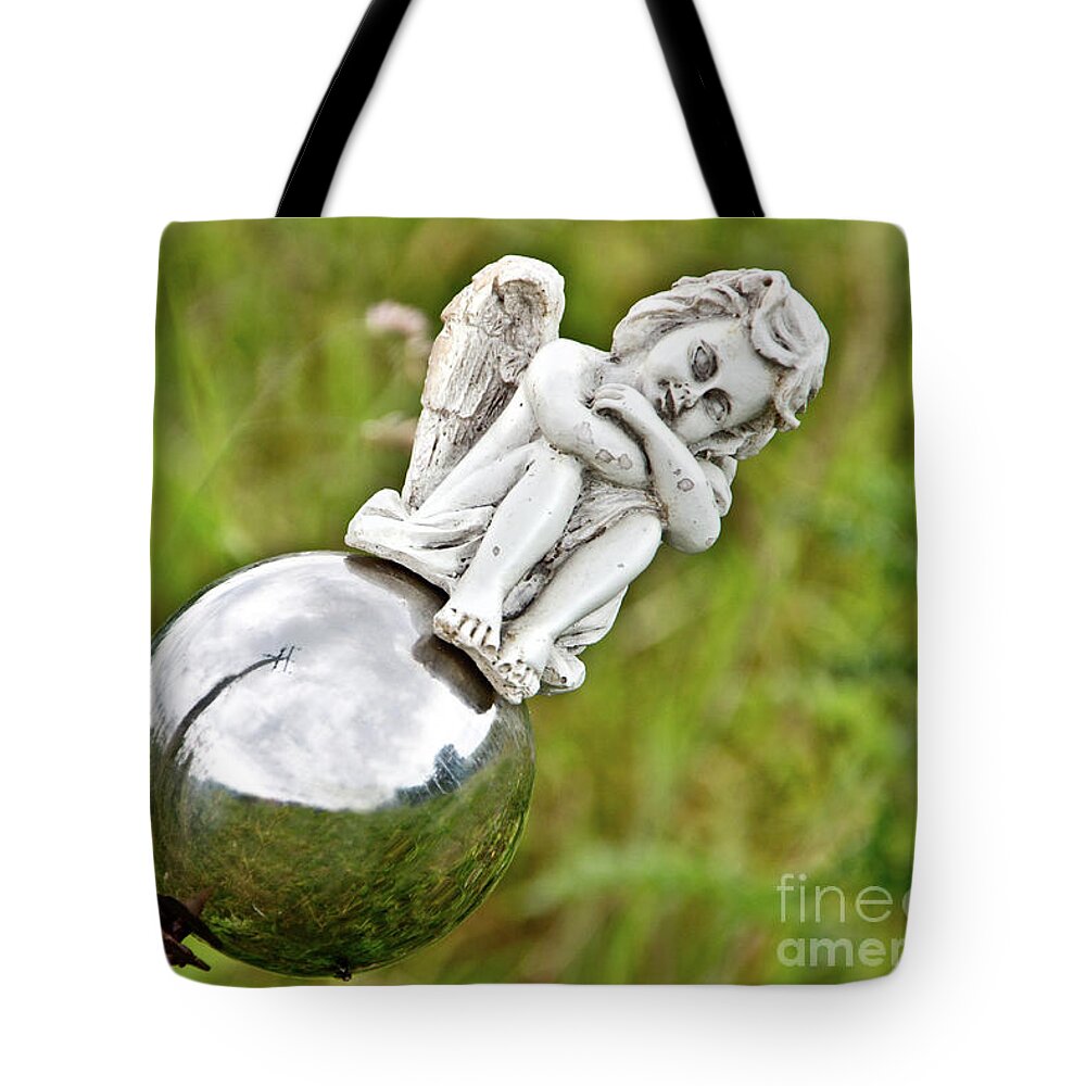 Photograph Tote Bag featuring the photograph Angel on her Silver Ball by Adriana Zoon