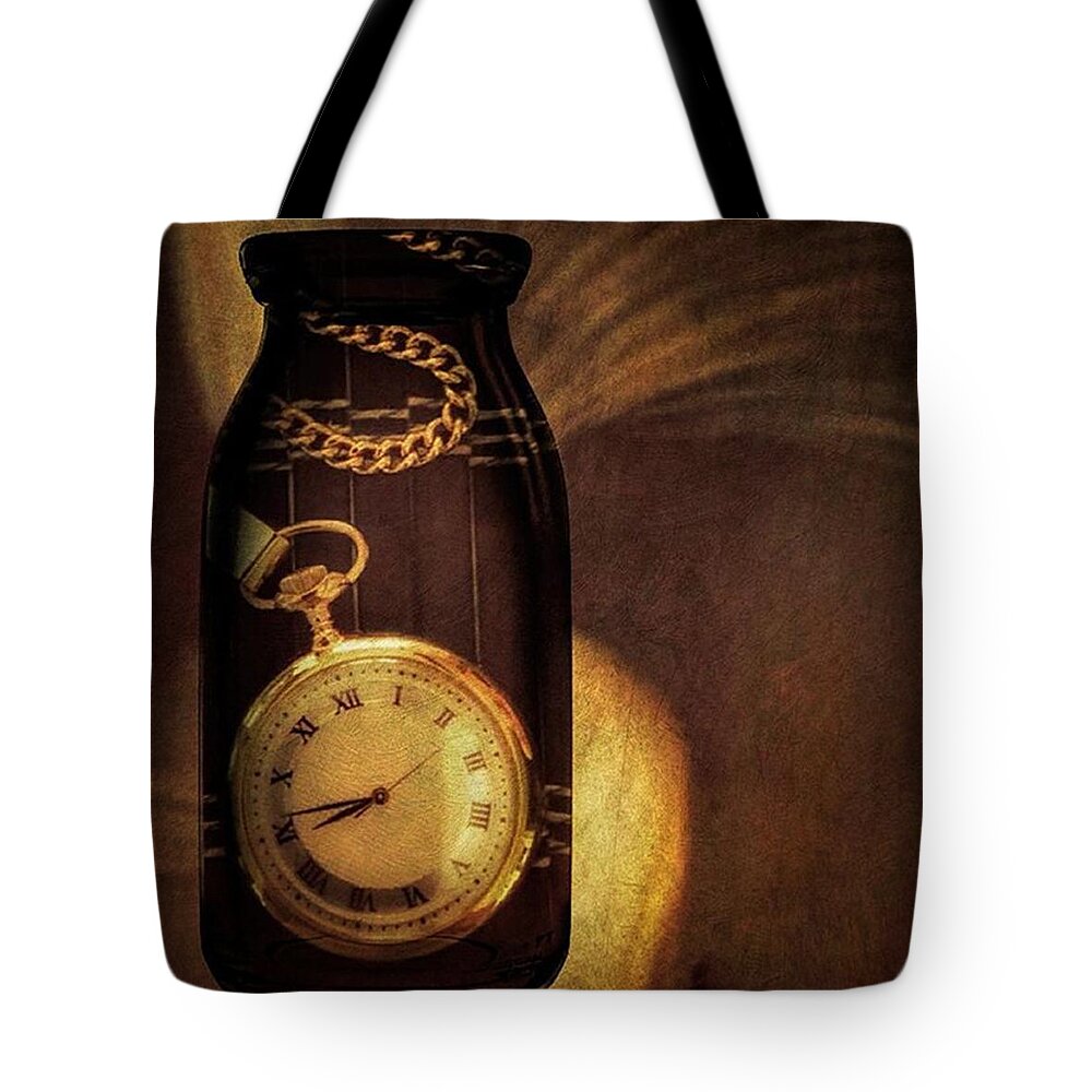 Watch Tote Bag featuring the photograph Antique Pocket Watch In A Bottle by Susan Candelario