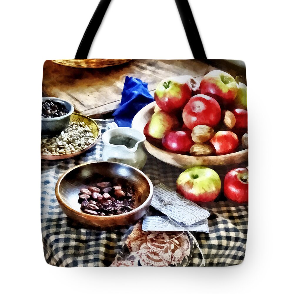 Apples Tote Bag featuring the photograph Apples and Nuts by Susan Savad