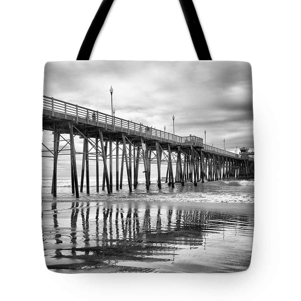 Pier Tote Bag featuring the photograph At the Pier by Barbara Manis