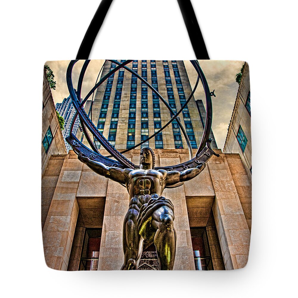 Atlas Tote Bag featuring the photograph Atlas at the Rock by Chris Lord