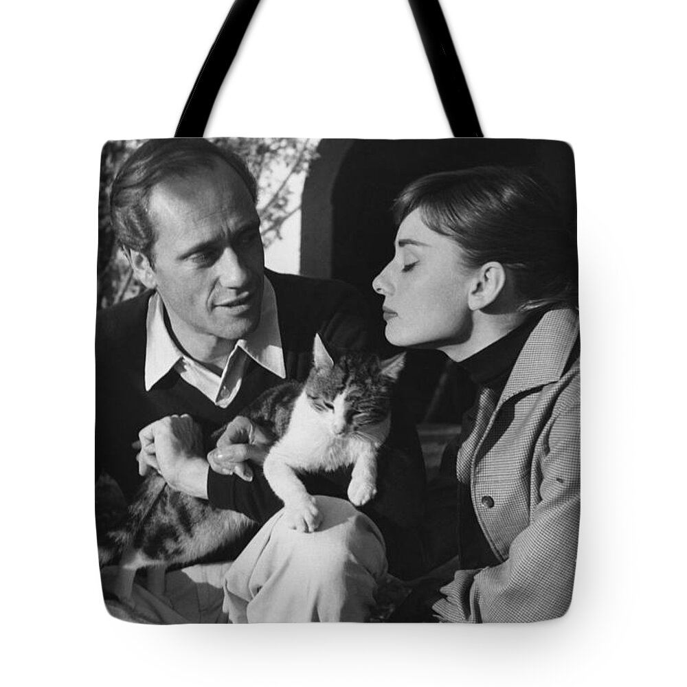 B&w Tote Bag featuring the photograph Audrey Hepburn and Mel Ferrer by George Daniell