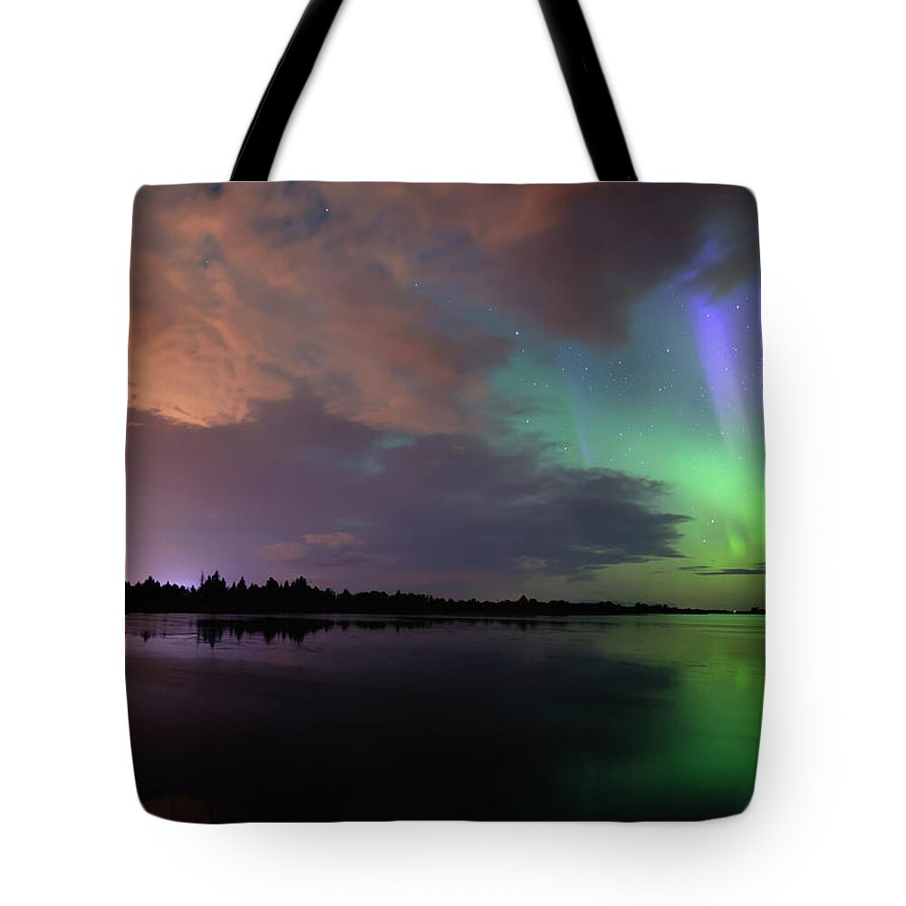 Aurora Borealis Tote Bag featuring the photograph Aurora and Storm Clouds by Dan Jurak