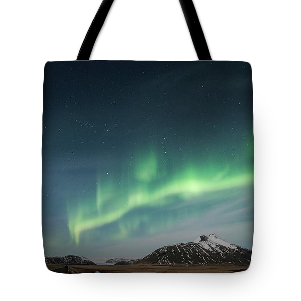 Iceland Tote Bag featuring the photograph Aurora Borealis Over Iceland by Sandra Bronstein