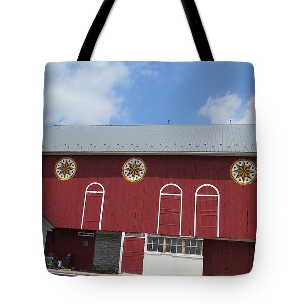 Red Barn Tote Bag featuring the photograph Barn with Hex Signs by Jeanette Oberholtzer