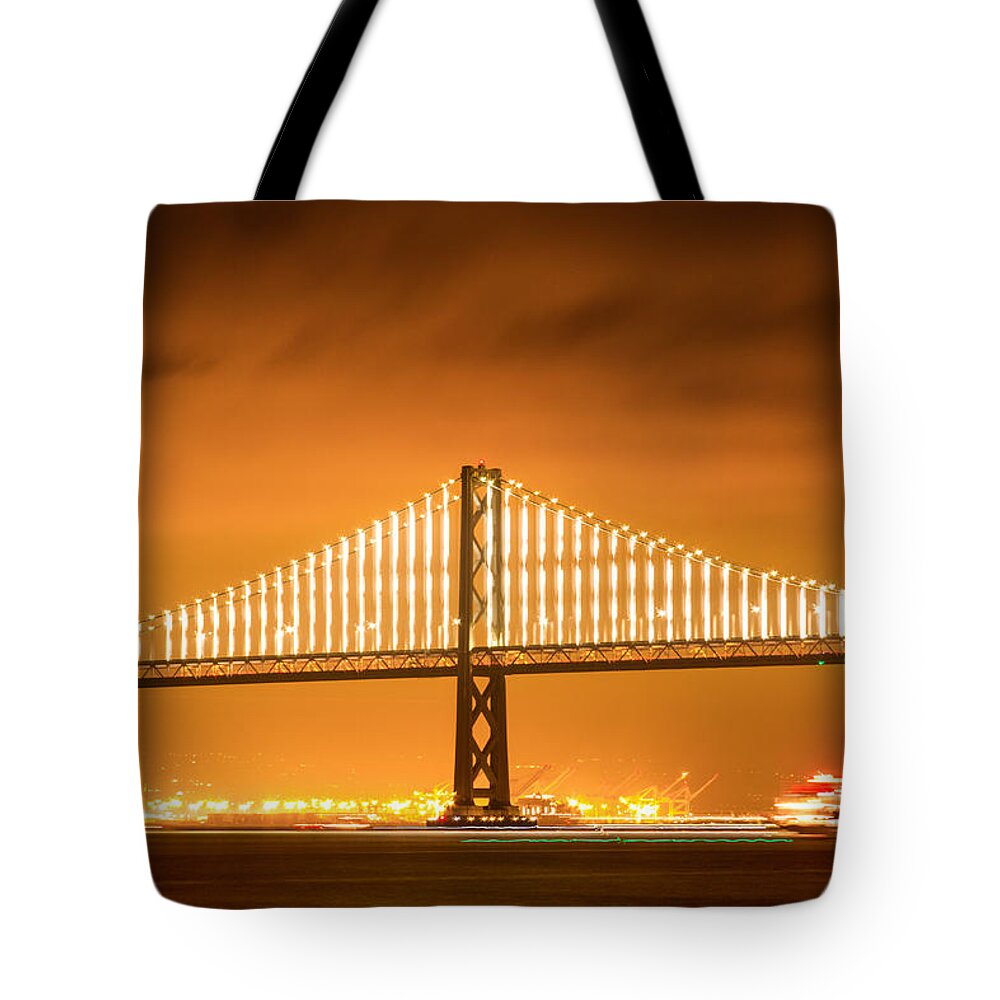 Bonnie Follett Tote Bag featuring the photograph Bay Bridge Span and Ferry at Night by Bonnie Follett