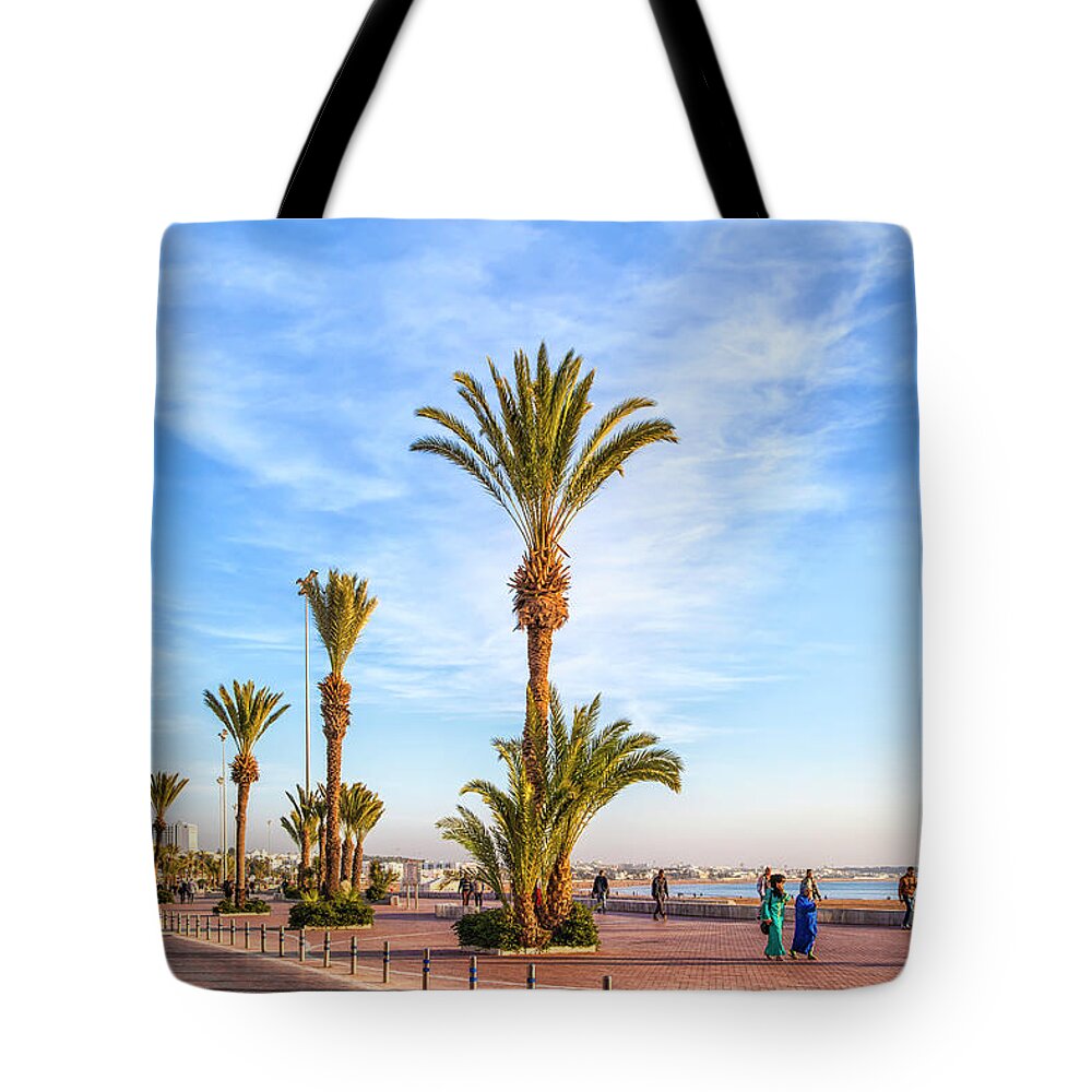 Africa Tote Bag featuring the photograph Beach promenade of the african harbor city Agadir in Morocco by Gina Koch