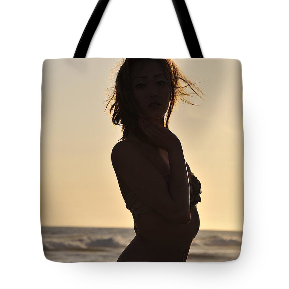 Glamour Photographs Tote Bag featuring the photograph Beach silhouette by Robert WK Clark