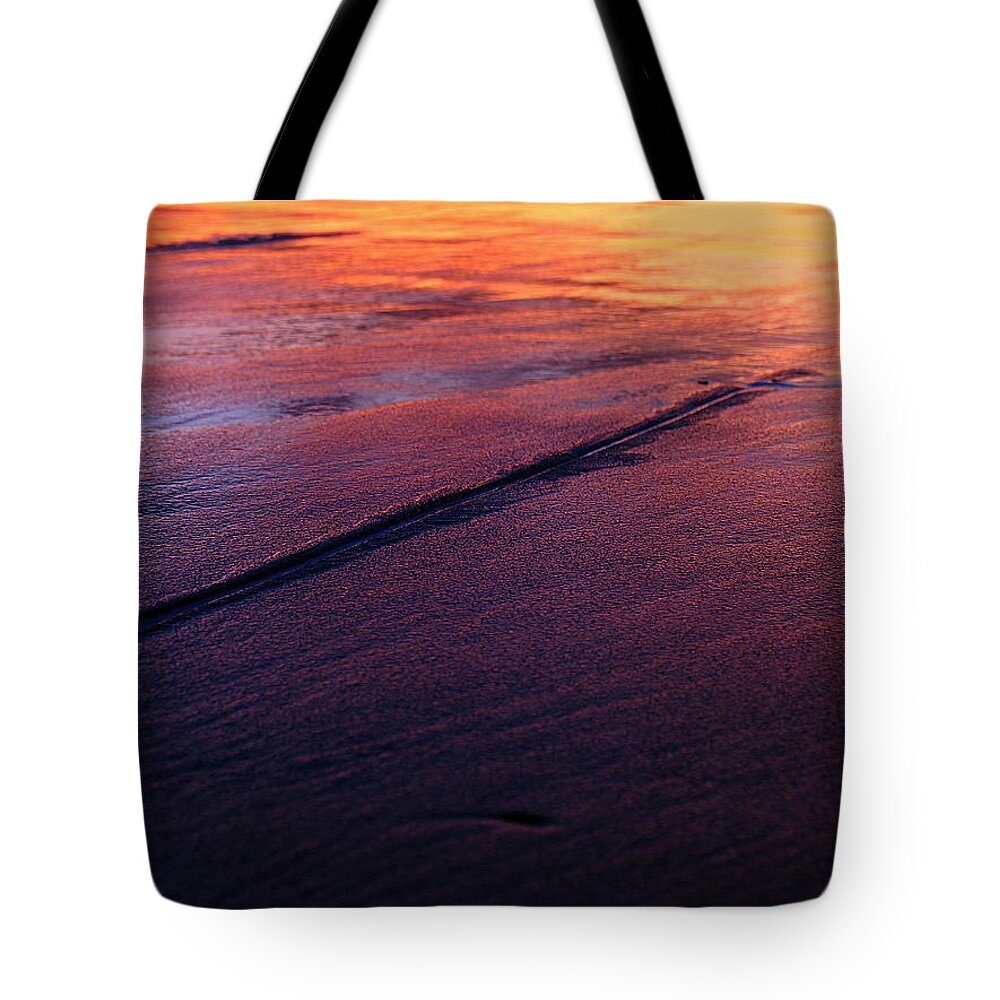 Beach Tote Bag featuring the photograph Beneath an Orange Sky by Juergen Roth
