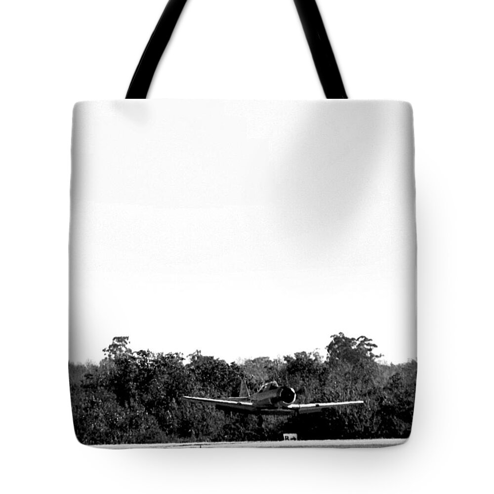 Airplane Tote Bag featuring the photograph Black and White A-6 Texan Touch and Go by Christopher Mercer