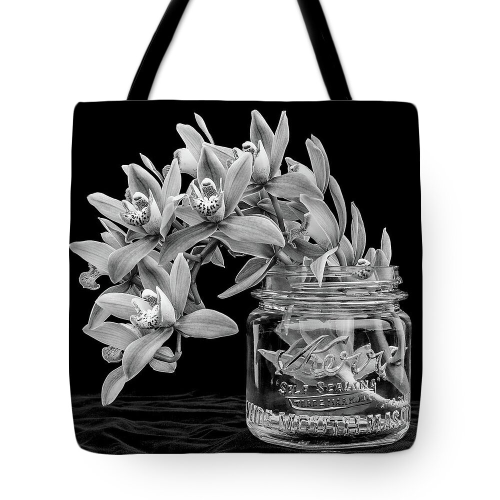 Orchid Tote Bag featuring the photograph Black and White Orchid Antique Mason Jar by Kathy Anselmo