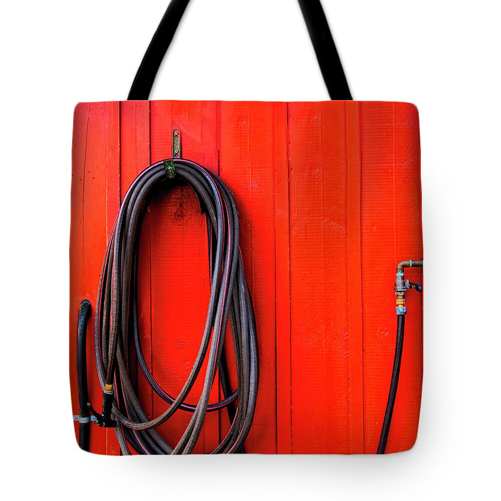 South Freeport Harbor Maine Tote Bag featuring the photograph Black Hose Red Wall by Tom Singleton