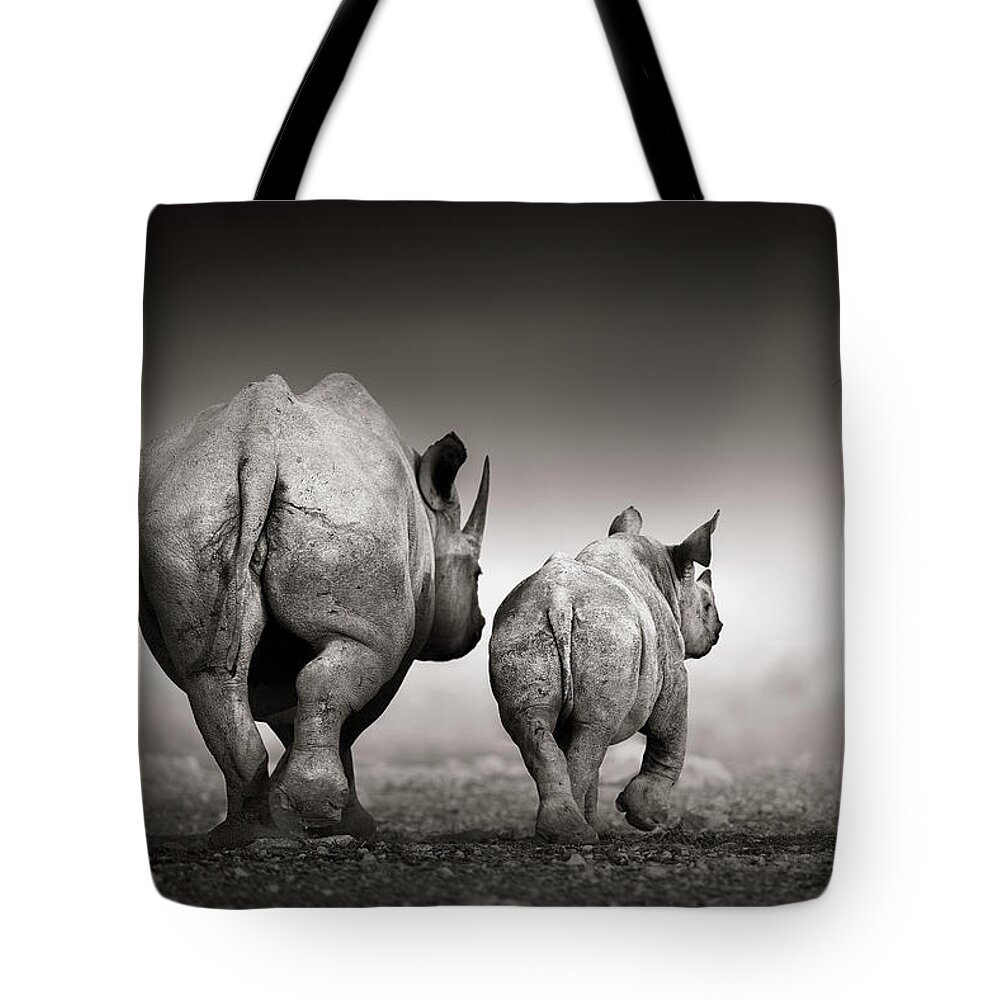 Rhinoceros Tote Bag featuring the photograph Black Rhino cow with calf by Johan Swanepoel