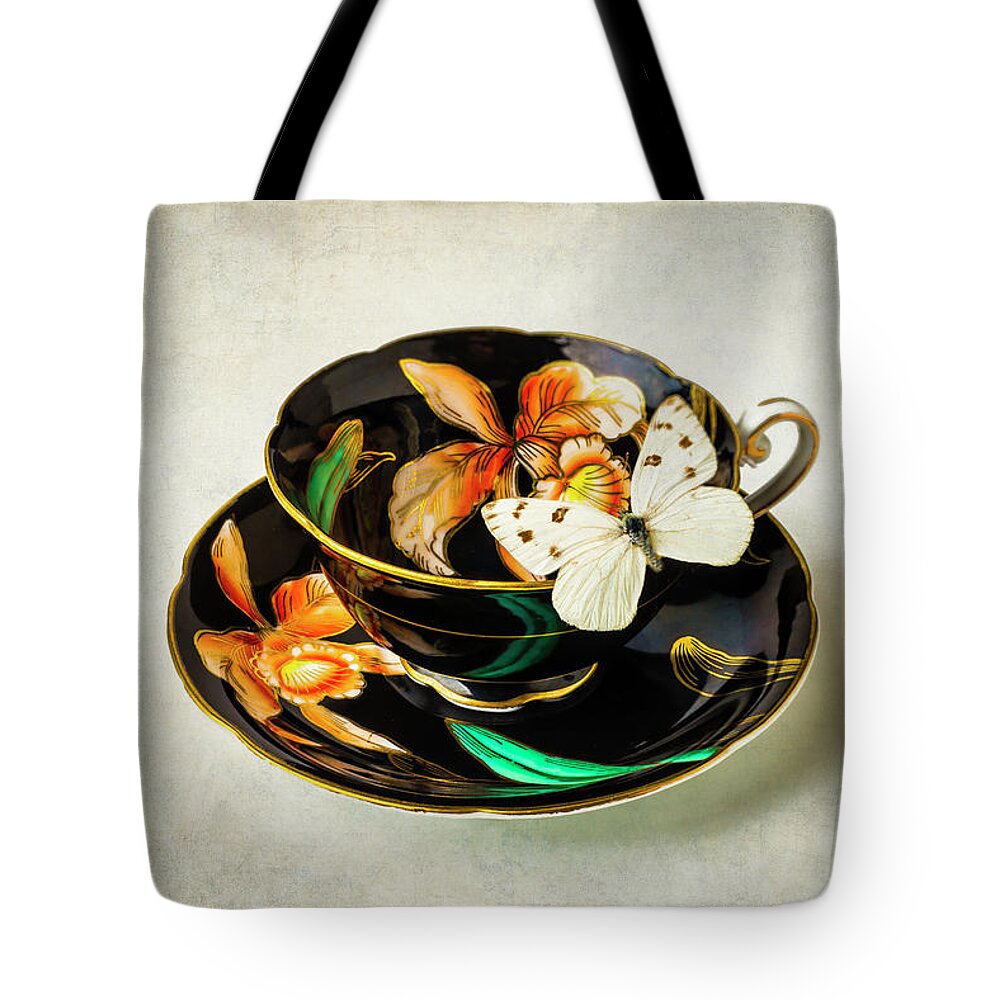 Colorful Tote Bag featuring the photograph Black tea Cup And White Butterfly by Garry Gay