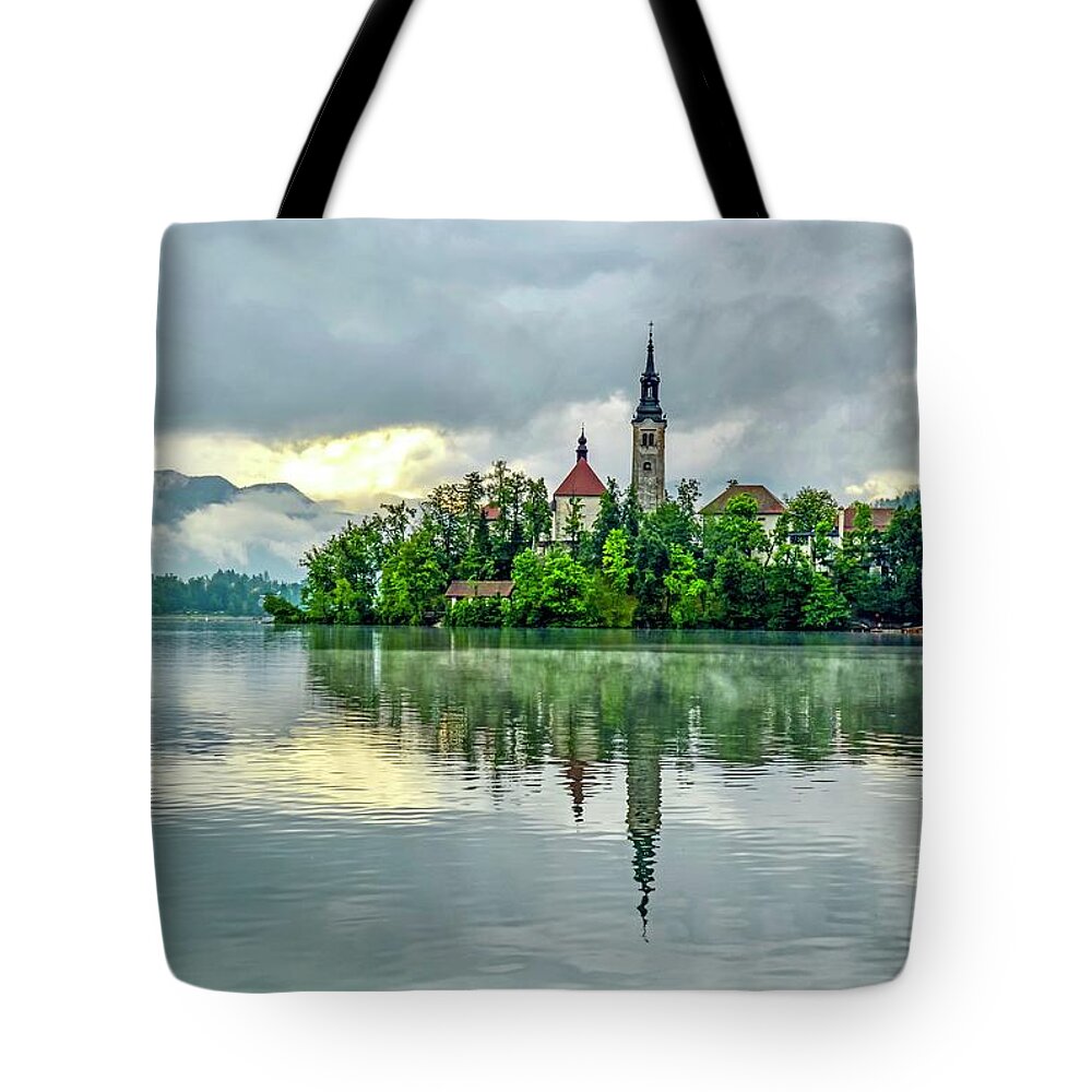 Lake Bled Tote Bag featuring the photograph Bled at Sunrise by Shannon Kelly