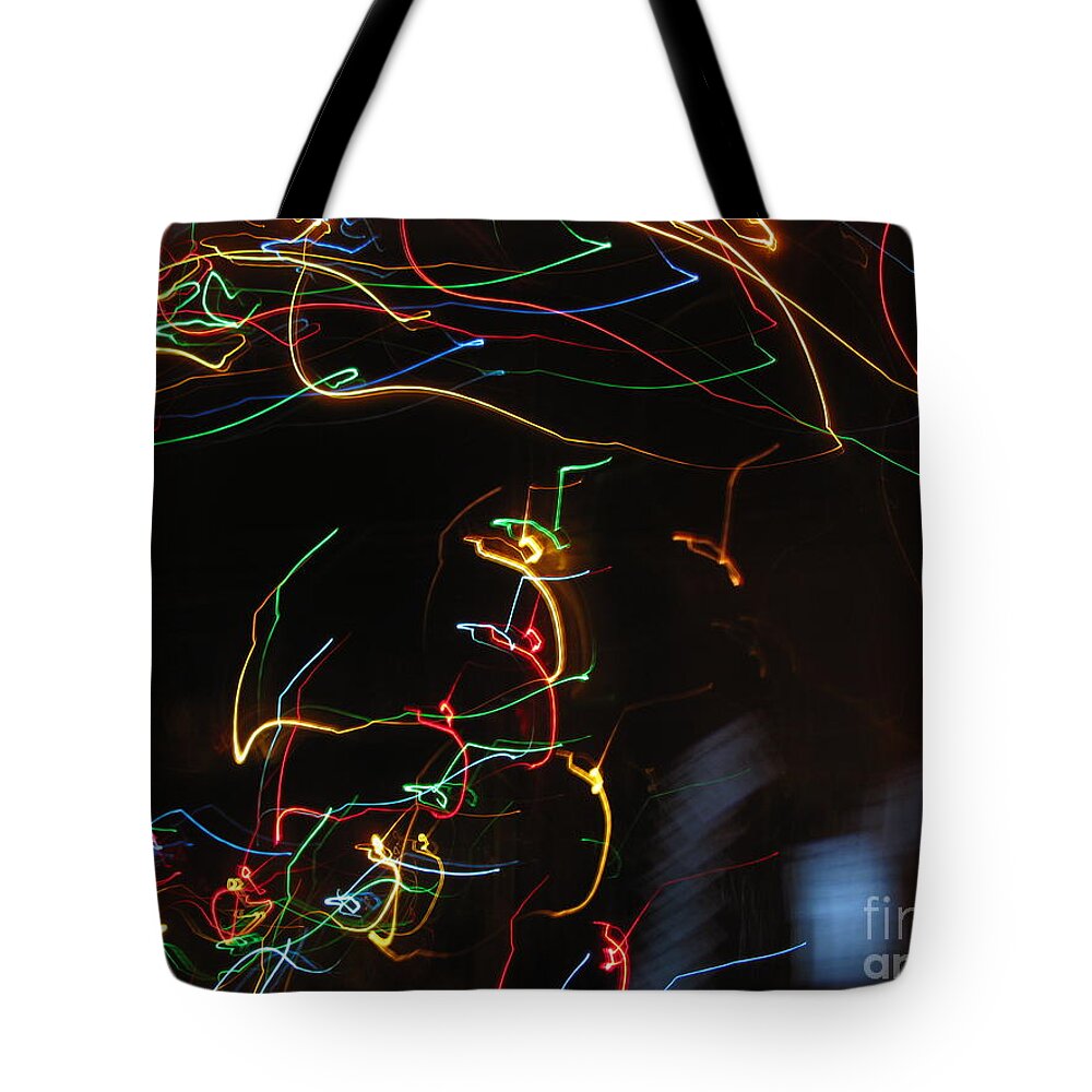 Dancing Lights Tote Bag featuring the photograph Blizzard of Colorful Lights. Dancing Lights series by Ausra Huntington nee Paulauskaite