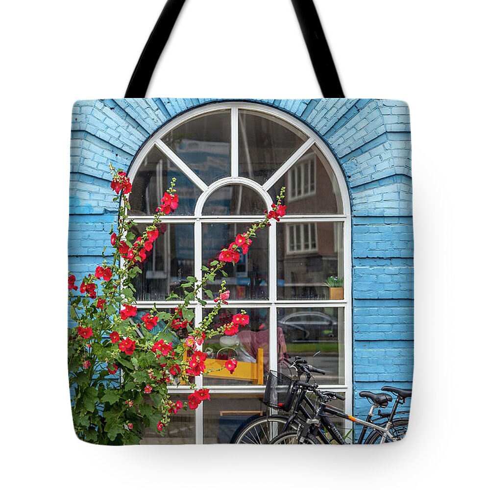 Copenhagen Tote Bag featuring the photograph Blue Brick Wall with Bicycles by W Chris Fooshee