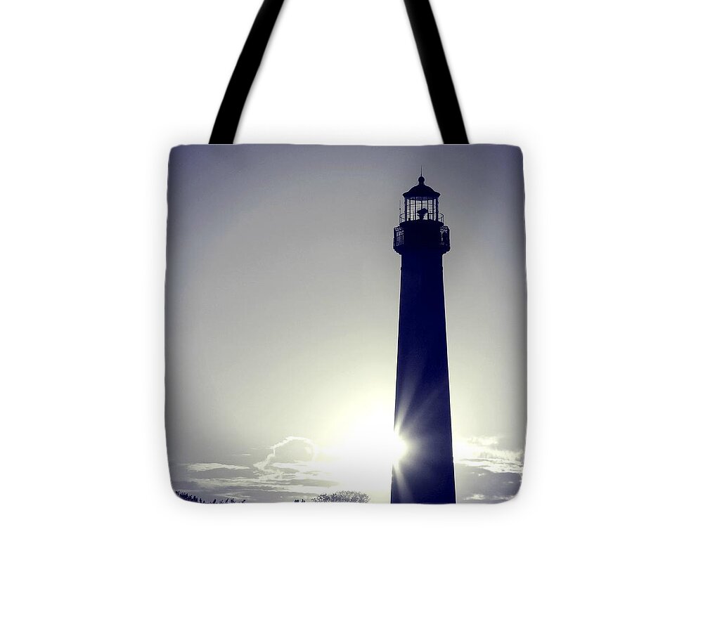 Blue Lighthouse Silhouette Tote Bag featuring the photograph Blue Lighthouse Silhouette by Dark Whimsy