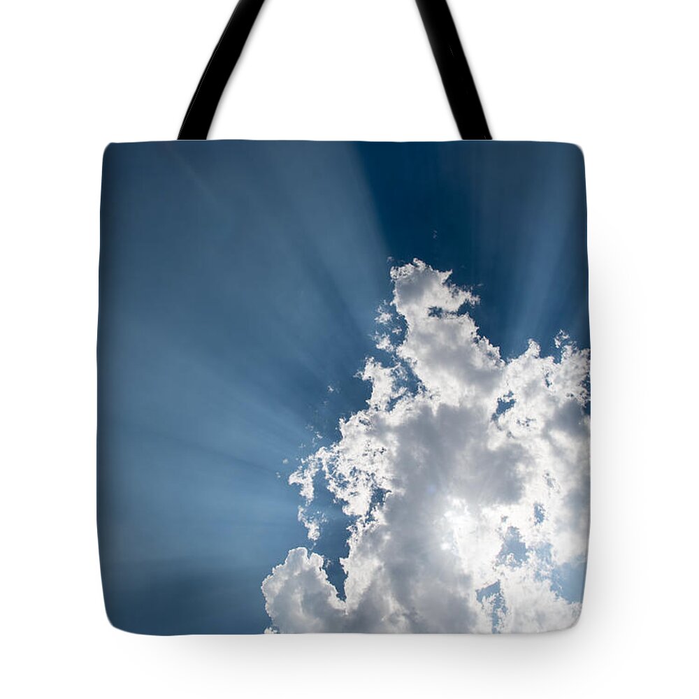 Atmosphere Tote Bag featuring the photograph Blue sky with white clouds and sun rays by Michalakis Ppalis