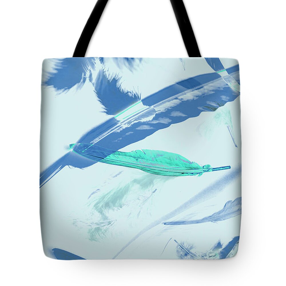 Abstract Tote Bag featuring the photograph Blue toned artistic feather abstract by Jorgo Photography
