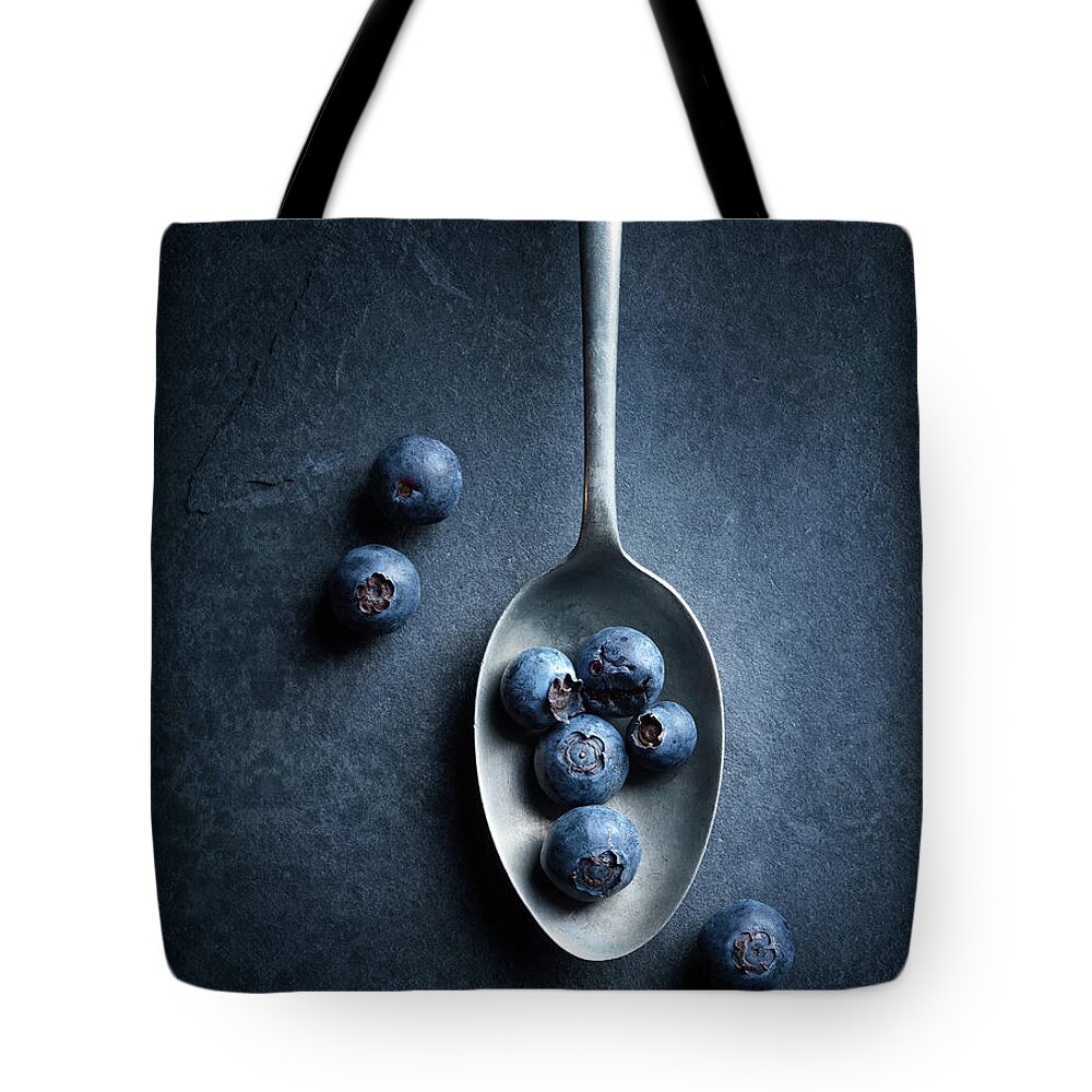 Blueberries Tote Bag featuring the photograph Blueberries on spoon Still Life by Johan Swanepoel