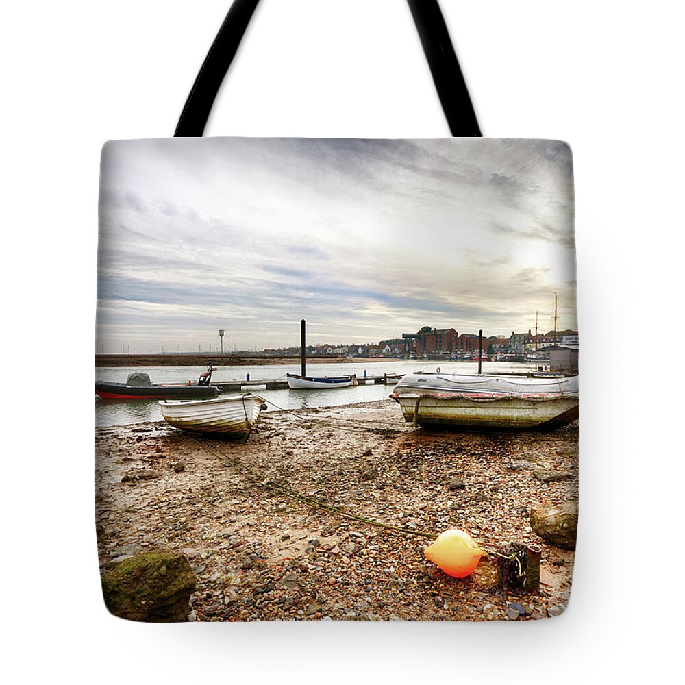 Norfolk Tote Bag featuring the photograph Boat chained to orange buoy by Simon Bratt