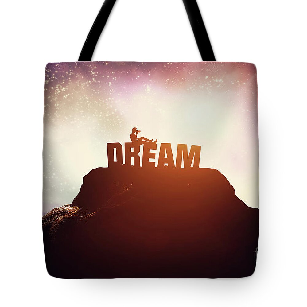 Dream Tote Bag featuring the photograph Boy sitting on a DREAM writing on the peak of a mountain. by Michal Bednarek