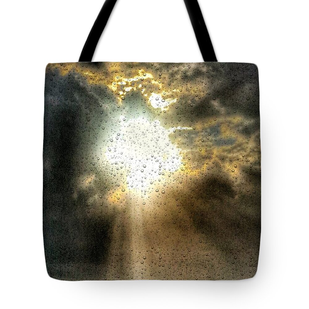 Storm Tote Bag featuring the mixed media Breaking Through by Jeffrey Canha