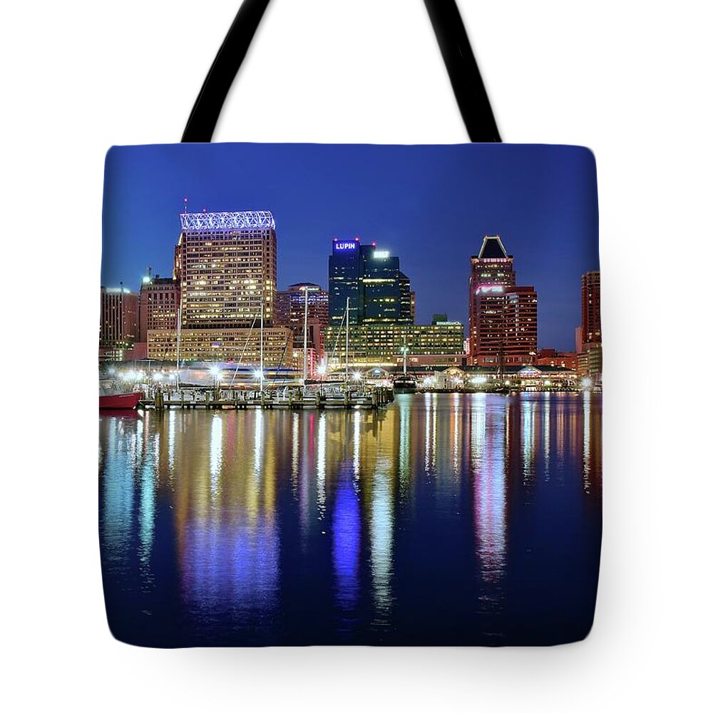 Baltimore Tote Bag featuring the photograph Bright Blue Baltimore Night by Frozen in Time Fine Art Photography