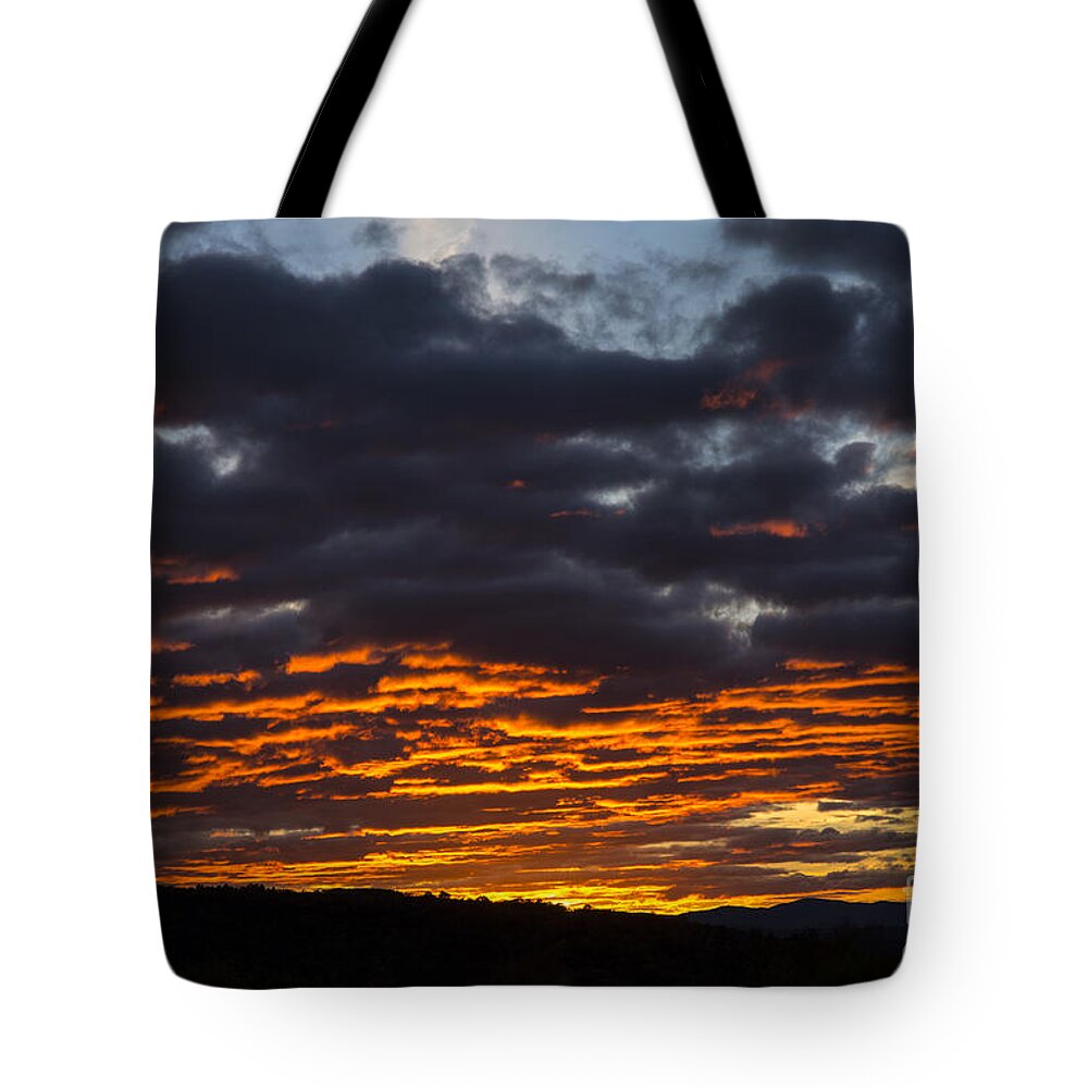 Sky Tote Bag featuring the photograph Bright Orange Clouds by Alana Ranney