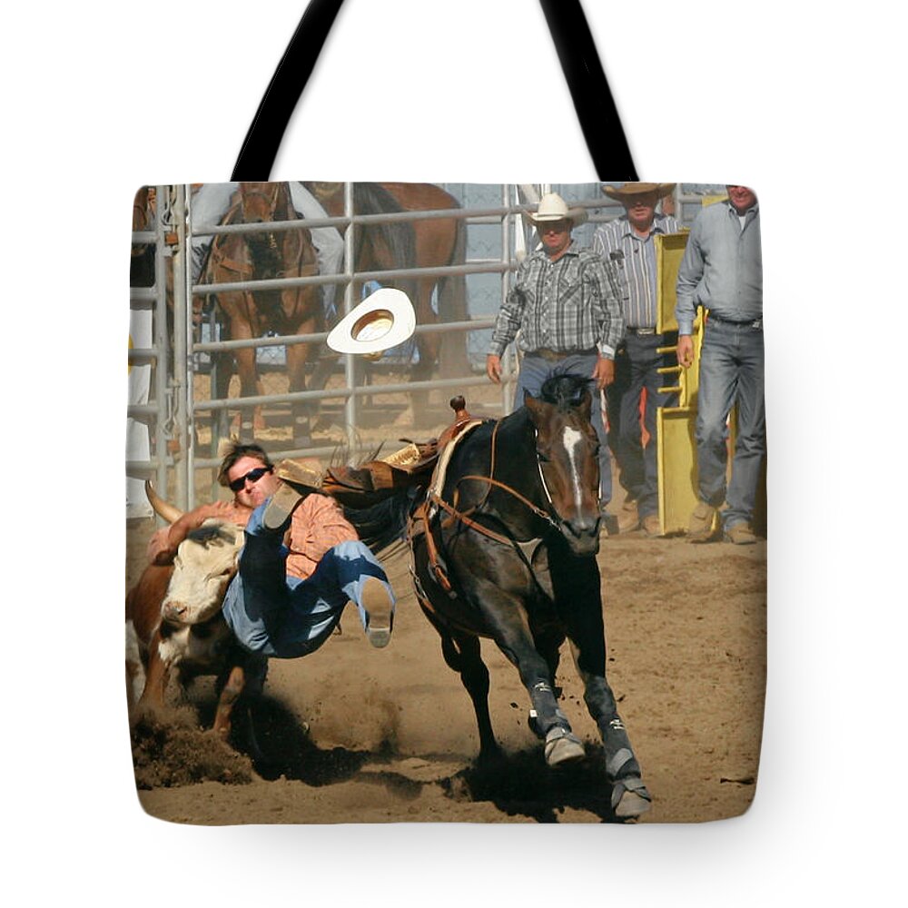 Cowboy Tote Bag featuring the photograph Bulldogging at the Rodeo by Alexandra Till