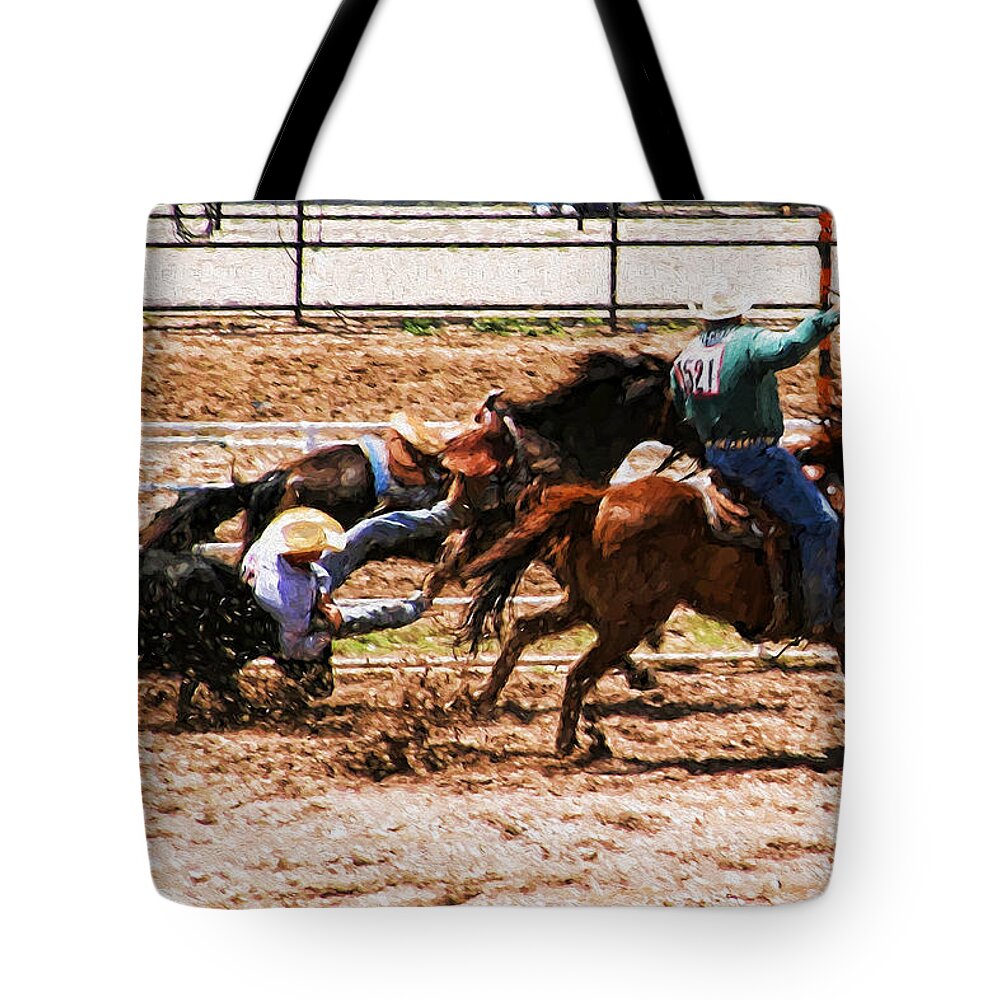 Rodeo Tote Bag featuring the photograph Bulldogging by John Freidenberg
