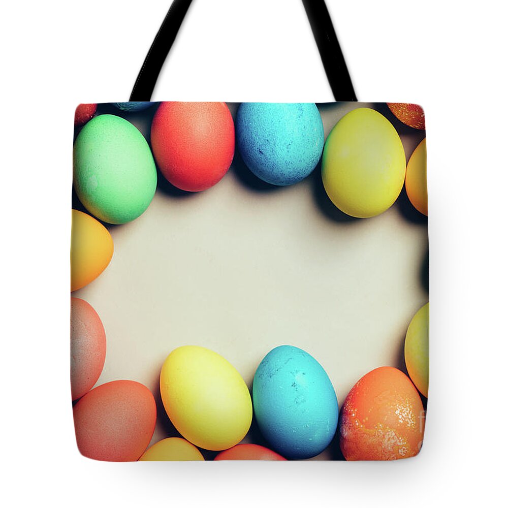 Egg Tote Bag featuring the photograph Bunch of home-dyed eggs. Copyspace. by Michal Bednarek