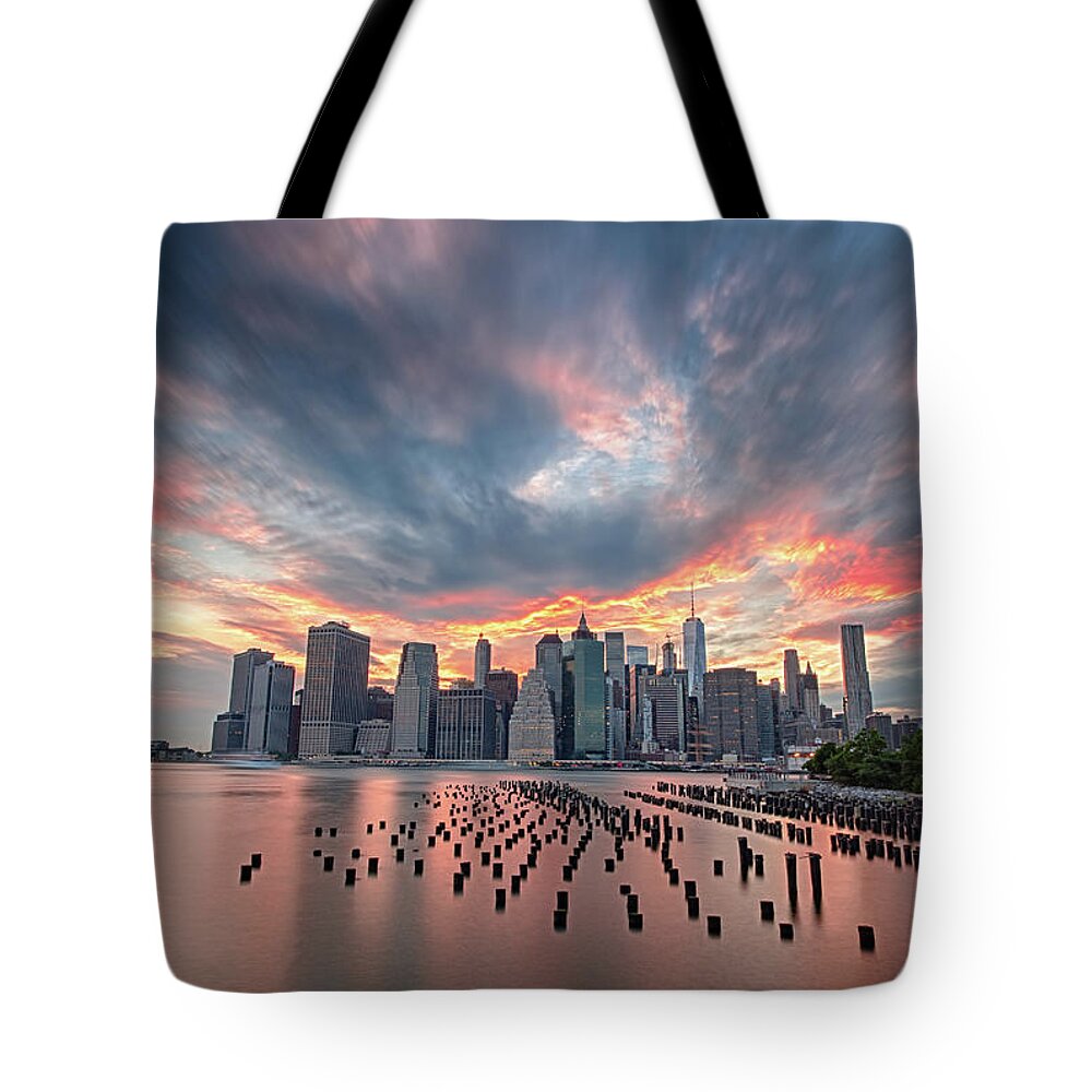 Manhattan Tote Bag featuring the photograph Burning Sunset over Manhattan by Raf Winterpacht