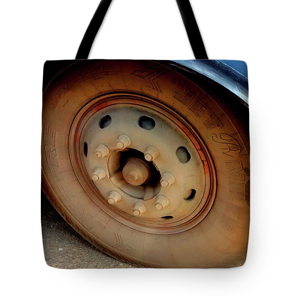 India Tote Bag featuring the photograph Bus Tyre by Misentropy