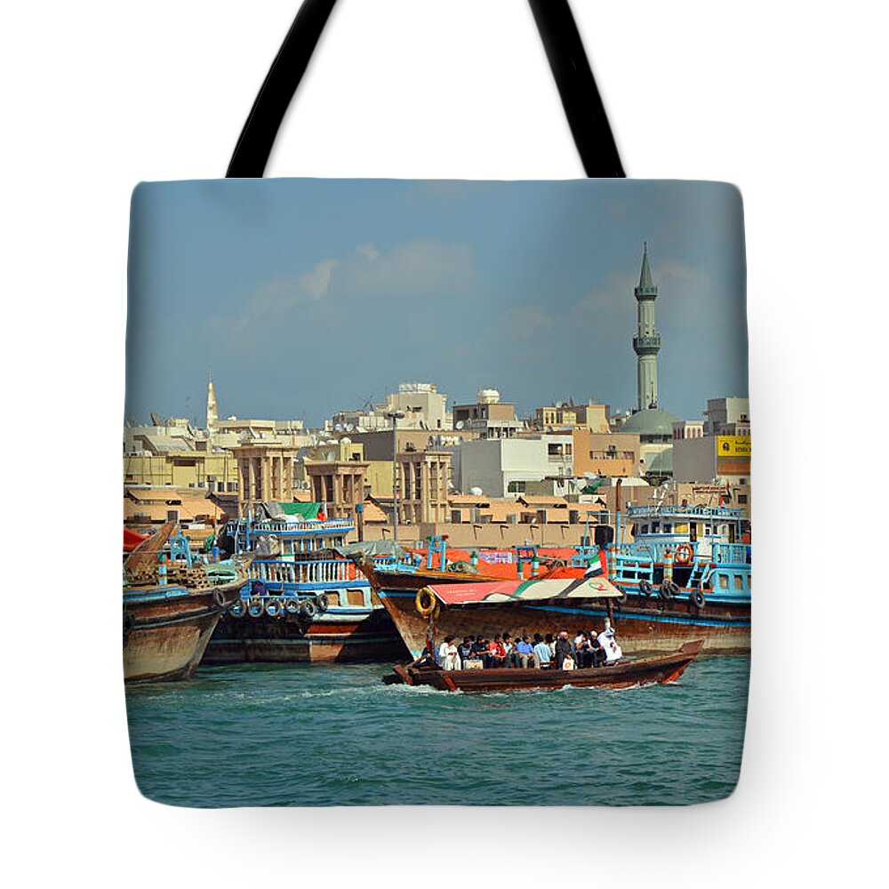 Dubai Tote Bag featuring the photograph Bustling in Blue by Corinne Rhode