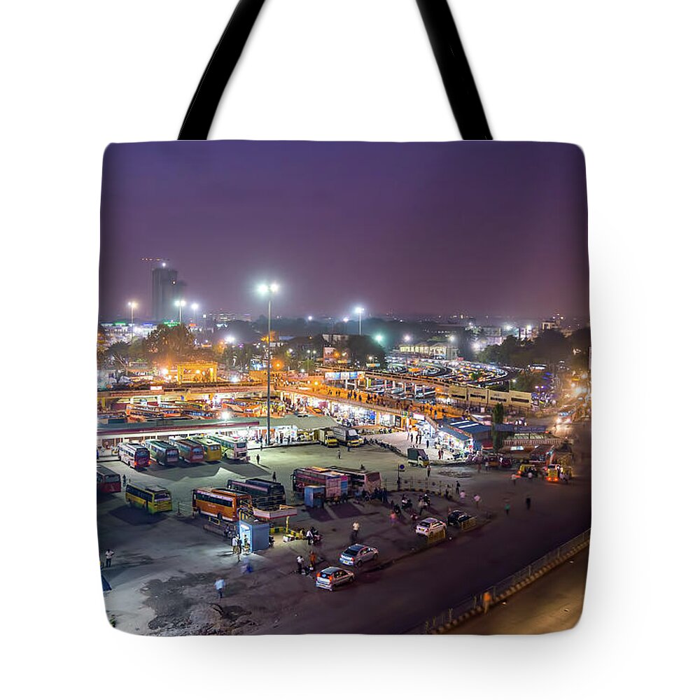 Bangalore Tote Bag featuring the pyrography Busy bus stand at night by Lalam Mandavkar