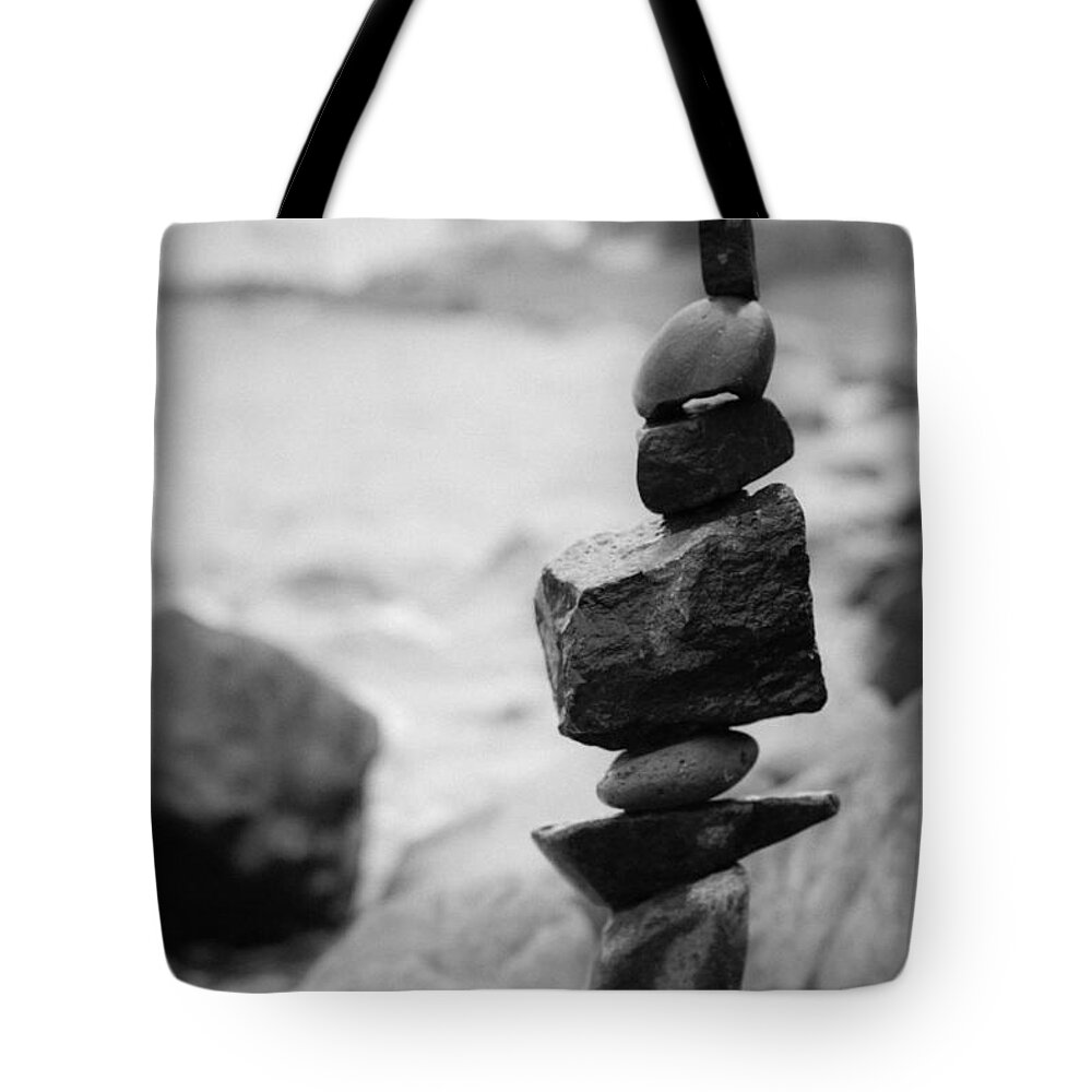 Zen Rocks Tote Bag featuring the photograph Cairn in black and white by Hermes Fine Art